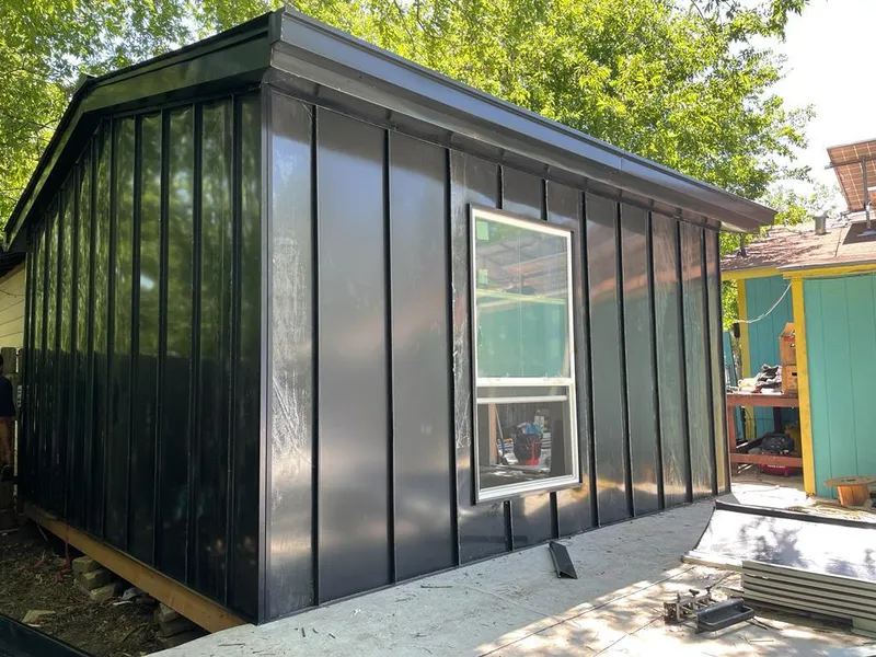 Black standing seam metal wall panels for Roof Inspection in Stratford